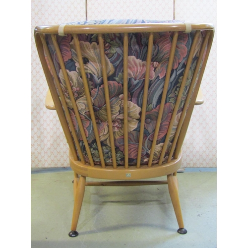 2396 - A vintage Ercol light beechwood Windsor style light stick back open elbow chair with loose cushions