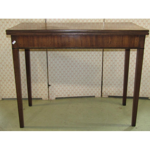 2400 - A Georgian mahogany rectangular foldover tea table with inlaid detail, 91cm wide