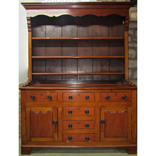 2409 - A Victorian farmhouse kitchen dresser, in mahogany, oak and stained pine, the base fitted with field... 