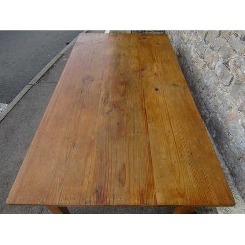 2459 - A stripped and waxed pine farmhouse kitchen table with rectangular plank top to seat six, 164 cm lon... 