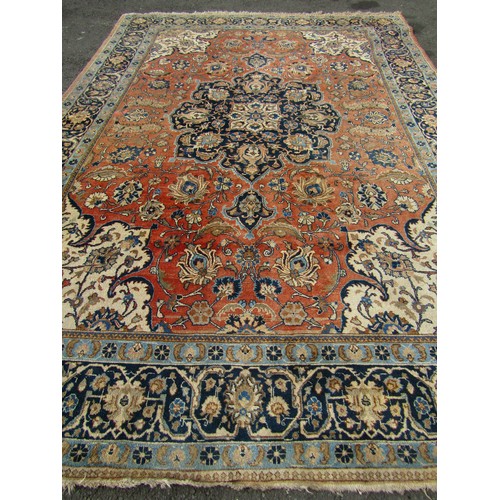 2526 - A large Malayer carpet, faded, with a central medallion with an overall floral pattern on pink groun... 