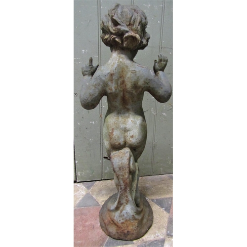 2091 - A vintage cast iron garden ornament in the form of a standing nude cherub with wavy hair and hands a... 