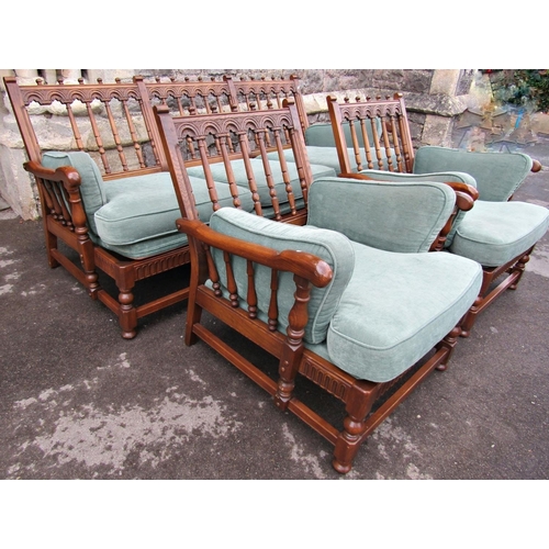 2200 - An Ercol Colonial three piece suite comprising three seat sofa and a pair of matching armchairs with... 