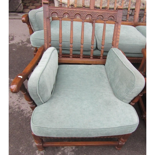 2200 - An Ercol Colonial three piece suite comprising three seat sofa and a pair of matching armchairs with... 