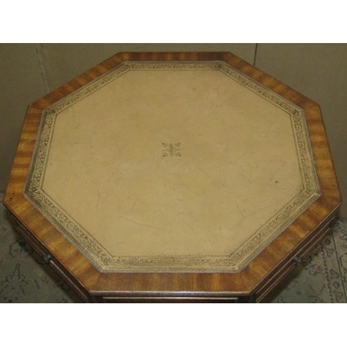 2417 - A reproduction Georgian style octagonal revolving library table with inset leather panelled top over... 