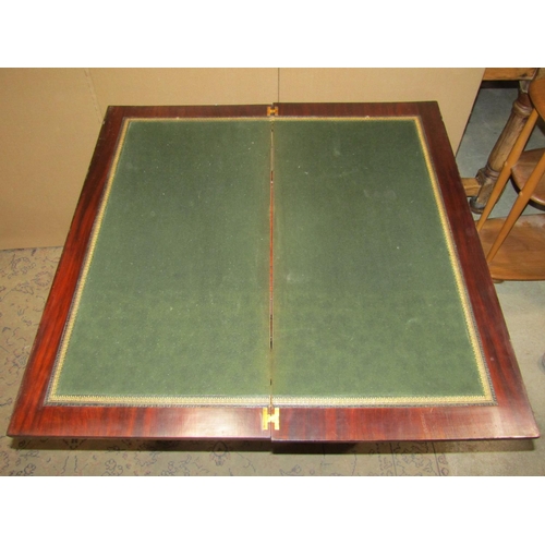 2424 - An inlaid Edwardian mahogany fold over top card table fitted with two frieze drawers raised on squar... 