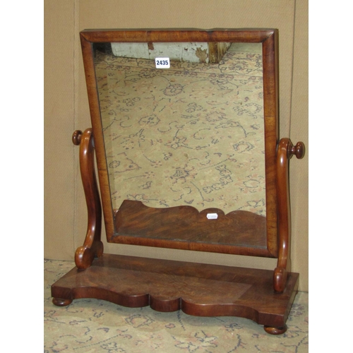 2435 - A Victorian mahogany toilet mirror with shaped platform base, together with a further example in the... 