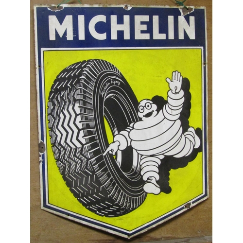 2491 - A vintage shield shaped enamel sign advertising Michelin Tyres 61 cm wide x 81 cm high