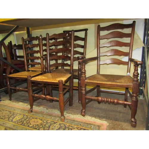 2643 - A collection of Georgian ladder and spindle back countrymade chairs, mainly in ashwood, with rush se... 