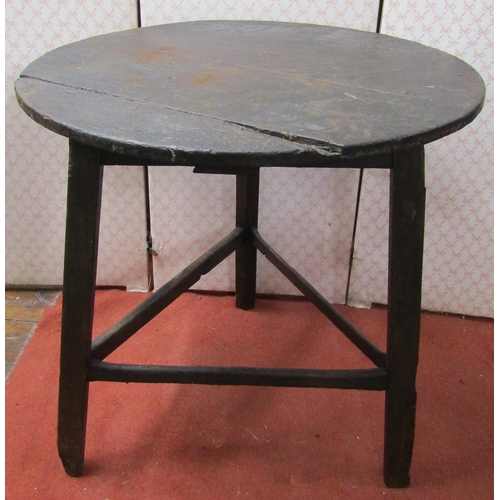 2690 - An antique cricket table, principally in pine, 69cm diameter