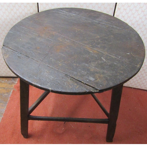 2690 - An antique cricket table, principally in pine, 69cm diameter