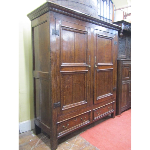 2700 - An 18th century oak livery cupboard enclosed by panelled doors with frieze drawers, 160cm wide x 175... 