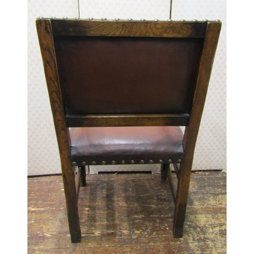 2732 - A set of seven Cromwellian style oak framed dining chairs, with Hyde upholstered seats and backs and... 