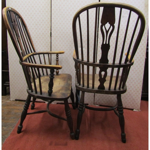 2757 - A matched pair of Georgian Windsor comb back elbow chairs principally in ash with dished seats, turn... 