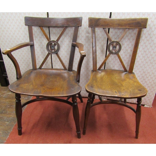 2764 - A Georgian Trafalgar back Windsor elbow chair and matching single chair, the seats elm, the frames i... 