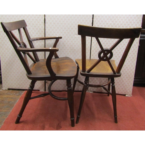 2764 - A Georgian Trafalgar back Windsor elbow chair and matching single chair, the seats elm, the frames i... 