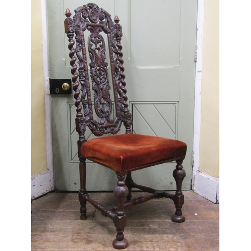 2772 - A Carolean style side chair in oak, with barley twist supports, carved and pierced splat and crestin... 