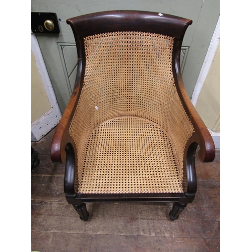 2780 - A 19th century mahogany bergere chair with scrolled back and arms