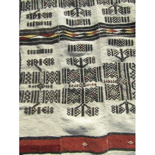 2501 - A West-African blanket with an intricate design of black line work on a natural wool ground, made-up... 