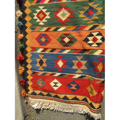 2502 - A South West Persian Qashquai Kilim with multi-coloured geometric design and tasseled selvages, 295c... 