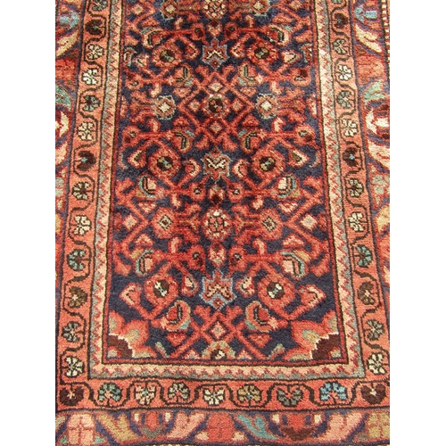 2505 - A North West Persian Malayer Runner with intricate central design and evenly spaced borders alternat... 