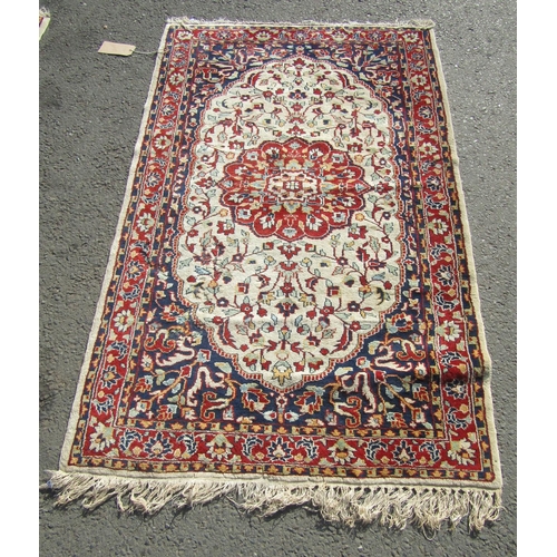 2506 - Pair of Persian rugs, each with central lobed medallion in madder on a natural wool ground, surround... 