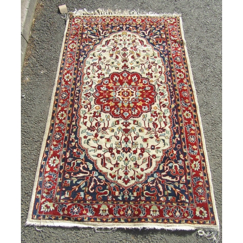 2506 - Pair of Persian rugs, each with central lobed medallion in madder on a natural wool ground, surround... 