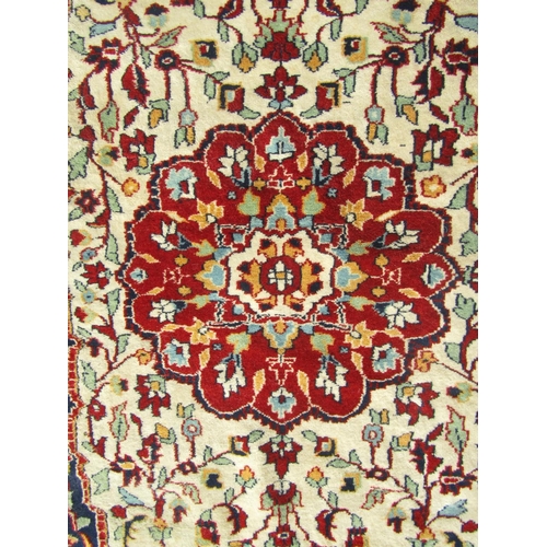 2506 - Pair of Persian rugs, each with central lobed medallion in madder on a natural wool ground, surround... 