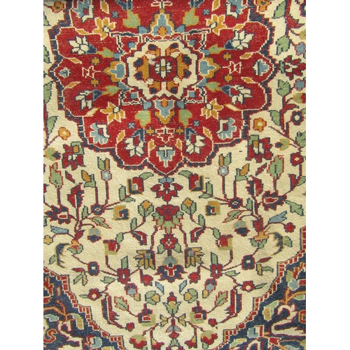 2506 - Pair of Persian rugs, each with central lobed medallion in madder on a natural wool ground, surround... 