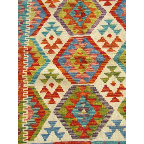 2507 - A Chobi kilim runner with continuous fetter motif design in multicoloured tones, 257cm x 83cm approx