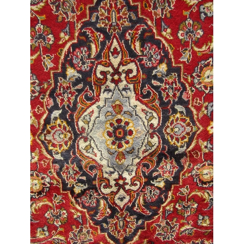 2525 - A Central Persian Kashan Carpet with book cover design in red, blue and natural wool tones with yell... 