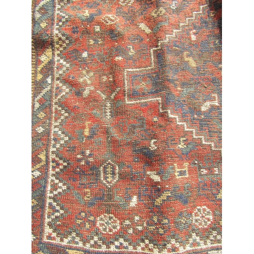 2529 - A Middle Eastern rug with three central medallions and animal motifs, hand-knotted wool on wool in t... 