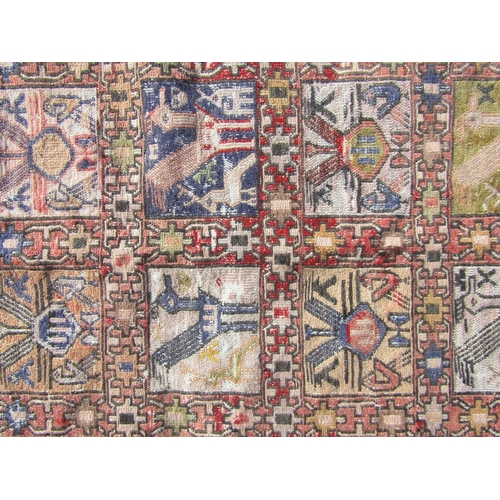 2530 - A Persian Soumak kilim rug with repeated animal design in pale primary tones of red, yellow, blue an... 