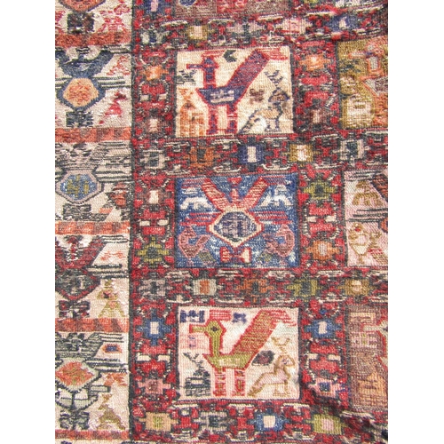 2530 - A Persian Soumak kilim rug with repeated animal design in pale primary tones of red, yellow, blue an... 