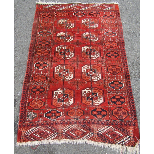 2538 - A Turkoman Tekke Rug with elephant foot design in mellow tones of orange, indigo and natural wool, 1... 