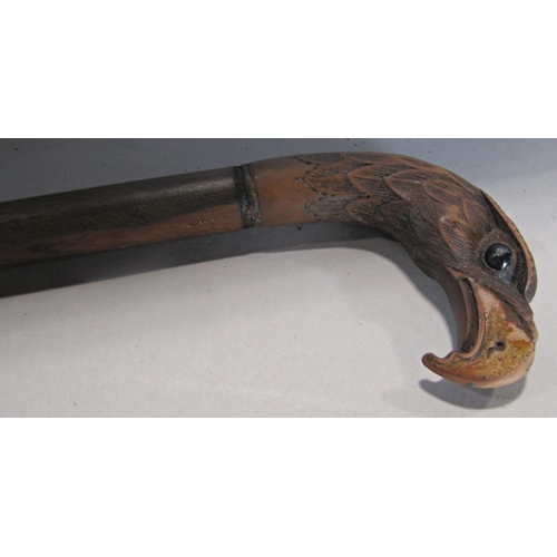 1704 - A 19th century brass reeded column oil lamp, with a semi opaque glass shade and chimney, 70cm high a... 