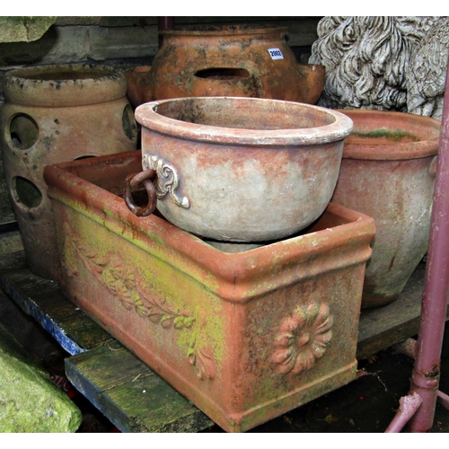 2002 - Two weathered terracotta strawberry planters of varying size and design, the largest example 43 cm h... 