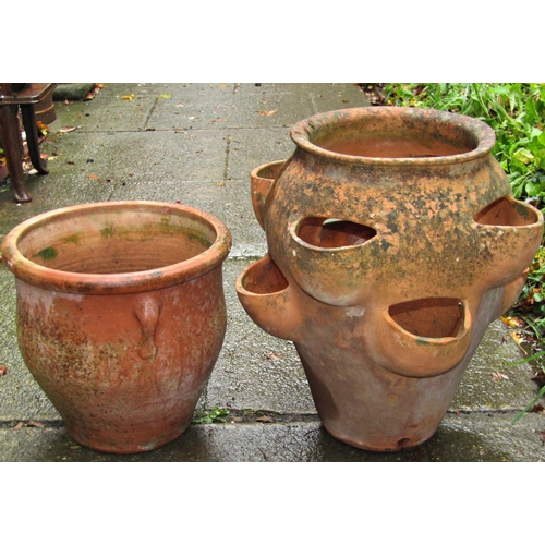 2002 - Two weathered terracotta strawberry planters of varying size and design, the largest example 43 cm h... 