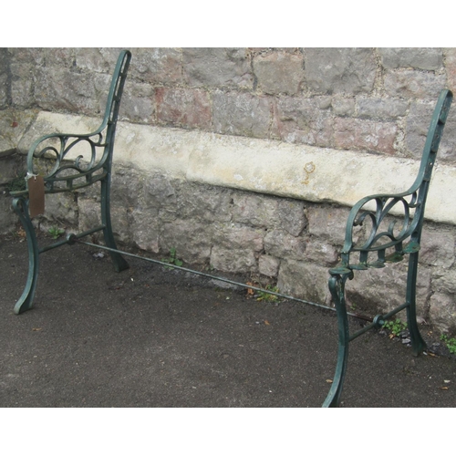 2010 - A pair of two seat garden benches with decorative cast iron end supports with open scroll detail (af... 