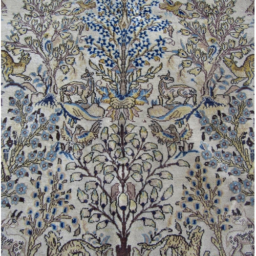 2539 - A Persian Tree of Life Design Rug in ochre, umber and blue tones, 140 x 210 cm