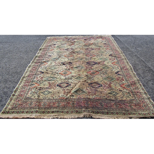 2540 - A Large Middle Eastern Rug with geometric design in neutral tones of brown, green and red, 320 x 240... 