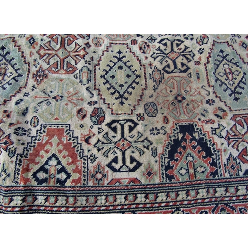 2540 - A Large Middle Eastern Rug with geometric design in neutral tones of brown, green and red, 320 x 240... 