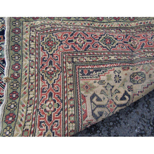 2540 - A Large Middle Eastern Rug with geometric design in neutral tones of brown, green and red, 320 x 240... 