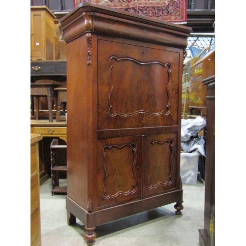 2321 - A 19th century mahogany secretaire abattant, the front elevation with well-matched flame veneers, en... 