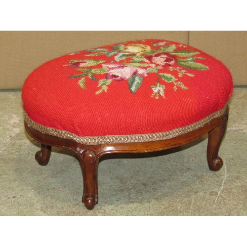 2326a - A small Victorian foot stool with oval floral tapestry top raised on scrolled cabriole supports 35cm... 