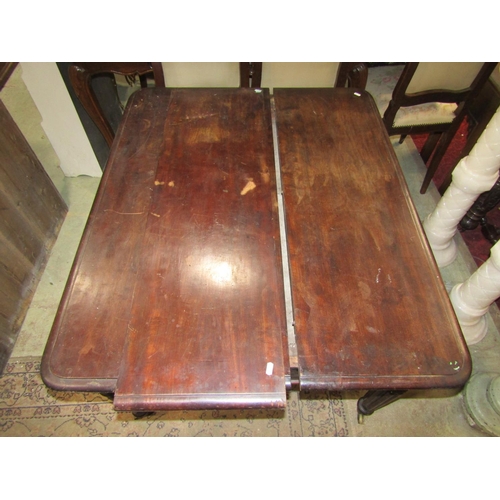 2445 - A 19th century mahogany pull out extending dining table of rectangular form, single additional leaf ... 