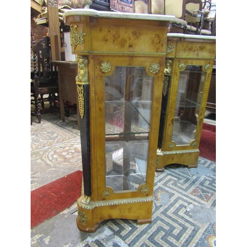 2454 - A matched pair of reproduction side/pier cabinets with applied gilt metal mounts, each enclosed by a... 