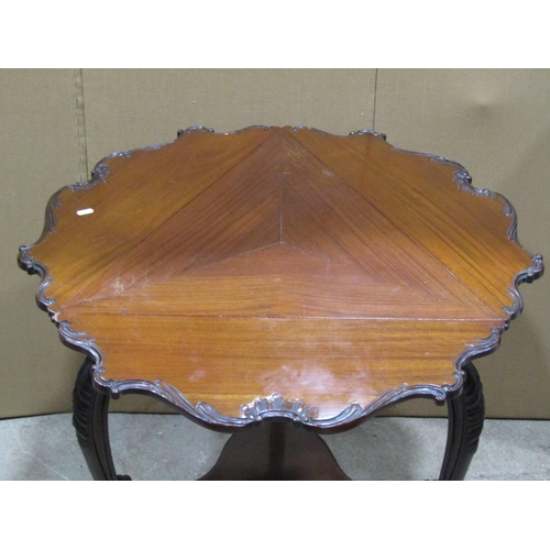 2461 - An Edwardian mahogany drop leaf triangular occasional/corner table raised on scrolled cabriole suppo... 