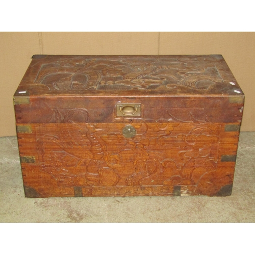 2462 - A camphor wood box with hinged lid carved detail and brass flush fittings, 83 cm wide x 45 cm deep x... 