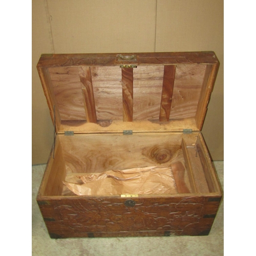 2462 - A camphor wood box with hinged lid carved detail and brass flush fittings, 83 cm wide x 45 cm deep x... 